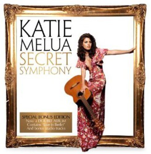 "Album cover with Katie Melua in a gold frame, holding a guitar."