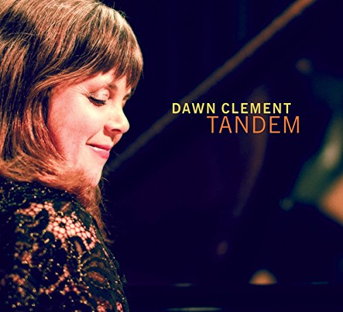Album cover featuring a woman with brown hair and a black top, eyes closed.