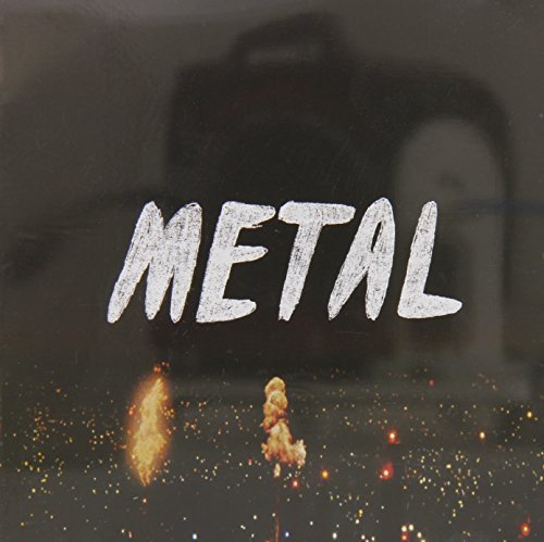 The alt text for the image is: "A CD cover with 'METAL' written in white, surrounded by sparks."