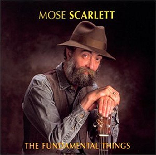 Man with beard and hat holding guitar, album cover with yellow text.