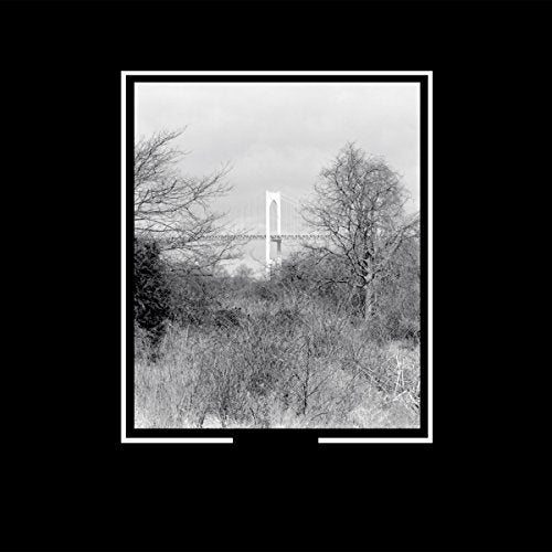 A black-and-white album cover featuring a landscape scene with bare trees and a bridge.