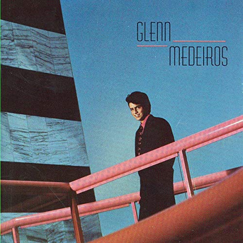Glenn Medeiros album cover: man in black suit on a red balcony.