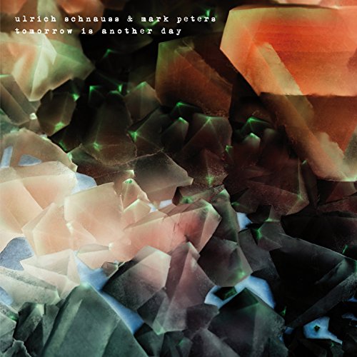 Vinyl album cover featuring abstract crystal formations in shades of orange, black, and white.