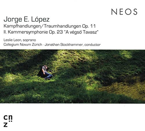 A CD cover featuring a person sitting in a grassy hillside with a body of water.