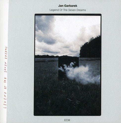 "Album cover with black and white photo of smoke in a field, light blue background."