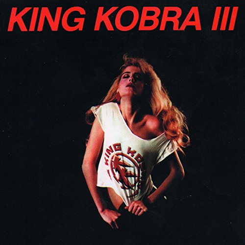 "Album cover with a blonde woman wearing a white 'King Kobra' t-shirt against a dark background."