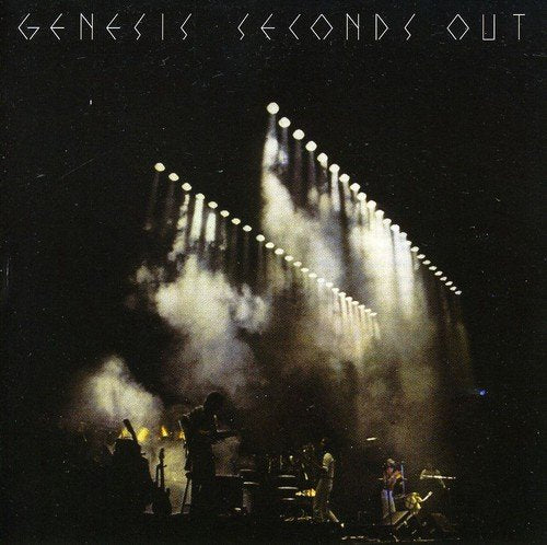 "Genesis album cover: band performing on stage with spotlights and smoke."