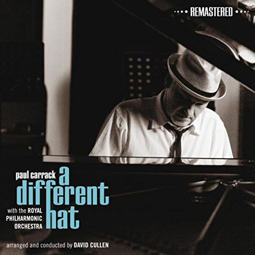 "Album cover with a man playing piano, wearing a hat, in black and white."