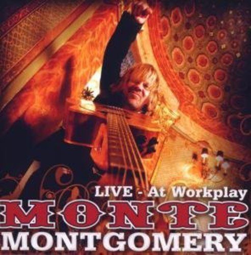 "Album cover featuring a man playing guitar on stage with ornate ceiling decorations."