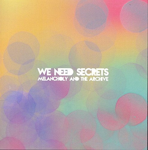 "Album cover with 'We Need Secrets' text on a multicolored, bokeh background."