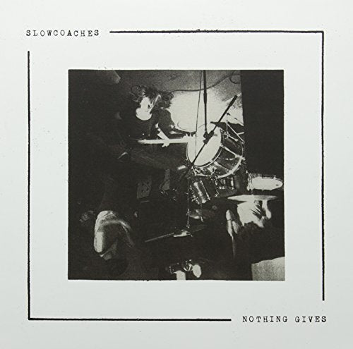 "Album cover with black and white photo of person playing drums, surrounded by thin black border."