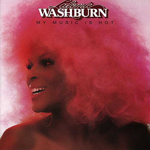 Album cover with a smiling woman and afro, surrounded by pink-red haze.