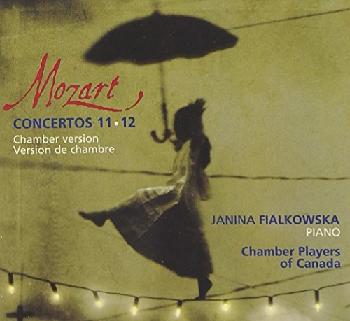 CD cover featuring a woman with an umbrella, string lights, and text.