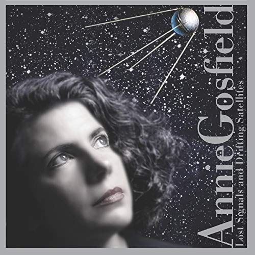"CD cover with a woman's face and a satellite in space."