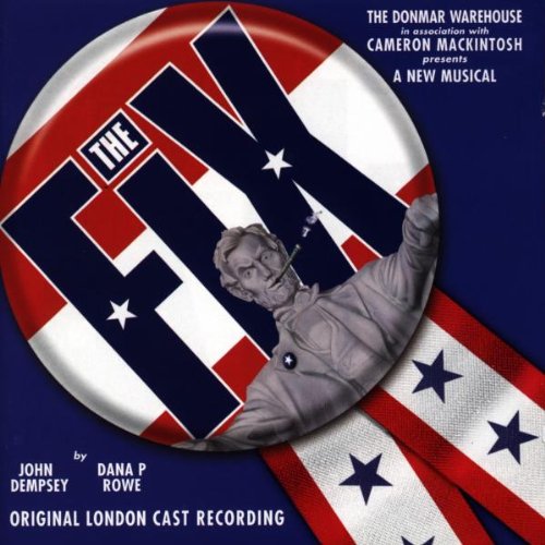 "CD cover with a button featuring a man and red, white, and blue design."