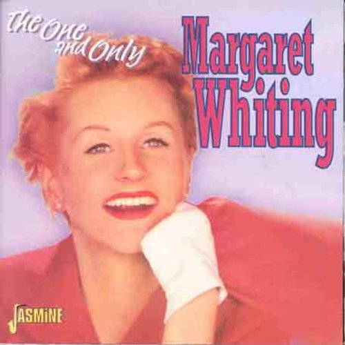 "Album cover featuring a smiling woman with blonde hair, red dress, and white glove."