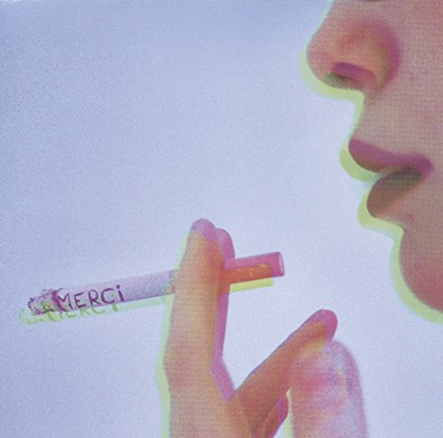 A person is smoking a cigarette with the word 'MERCI' written on it.