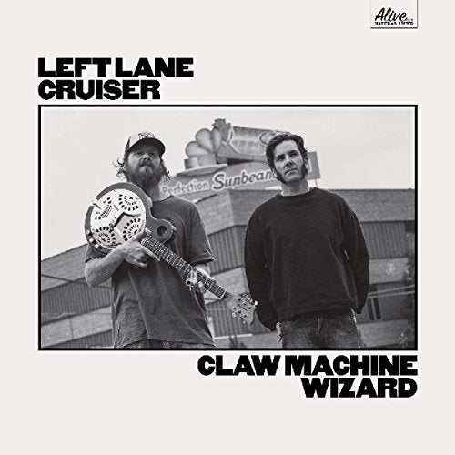 Album cover with two men standing in front of a building, one holding a banjo.