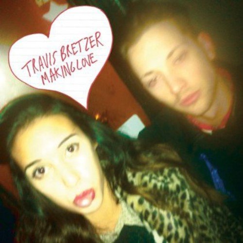 "Album cover with a man and woman, and a heart-shaped speech bubble with text."
