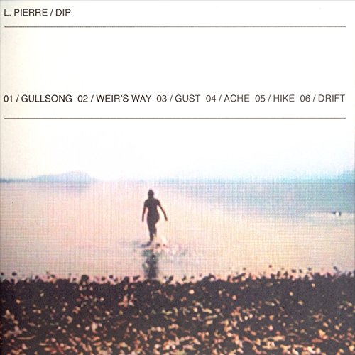 The image depicts a serene landscape with a person walking on a beach. #### Alt Text: "Album cover with a person walking on a misty beach at sunset."