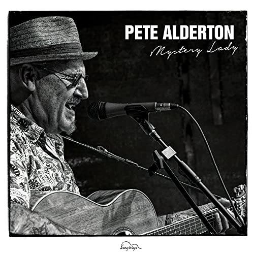 "Album cover featuring a black-and-white image of a man singing into a microphone."