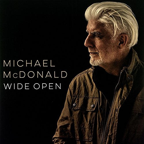 "Michael McDonald album cover featuring a man with white hair against a black background."