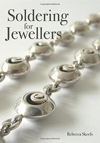 Book with soldering techniques for jewelry making, illustrated with diagrams and photos.