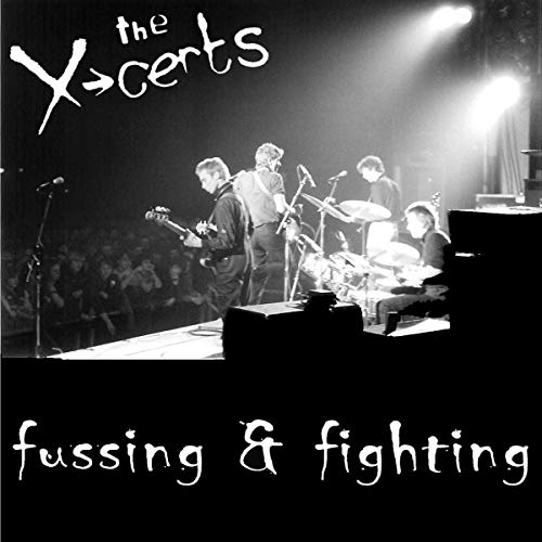 Black and white image of a band performing on stage, album cover artwork.