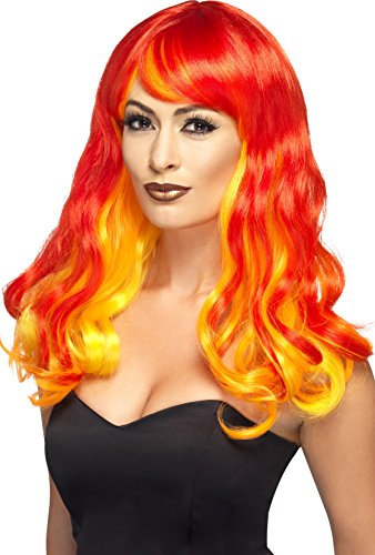 A woman wears a red-to-yellow ombre wig with long, curly hair and bangs.