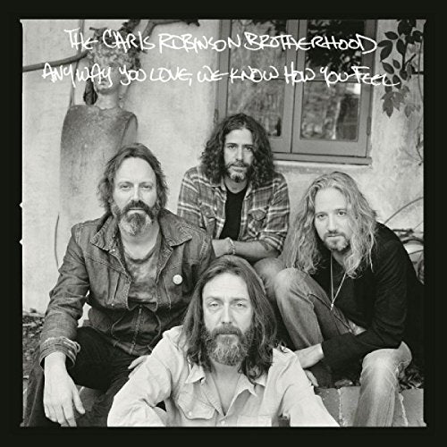 "Black and white vinyl album cover featuring a band of four men."