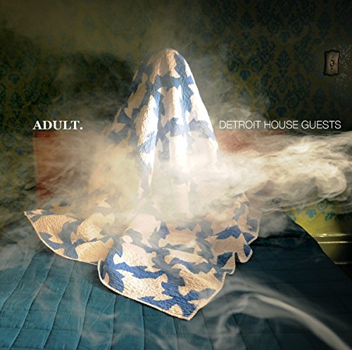 A vinyl record cover featuring a blue and white blanket on a bed, shrouded in smoke.