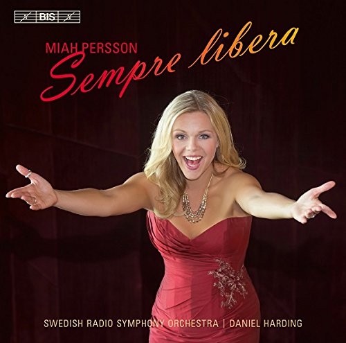"Album cover featuring a blonde woman in a red dress with outstretched arms."
