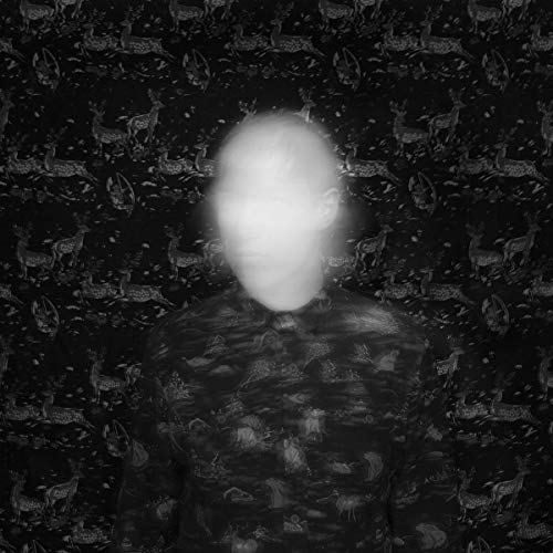 A black-and-white album cover featuring a person with a blurred, glowing face.