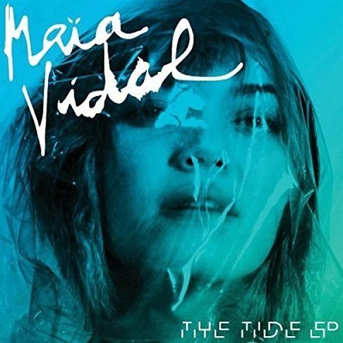 "Album cover featuring a woman's face with long hair, surrounded by blue-green hues."