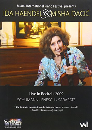 A DVD case with a disc, titled "Live In Recital 2009", in a plastic sleeve.