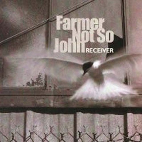 Album cover with a white bird flying over a metal fence, titled "Farmer Not So John".