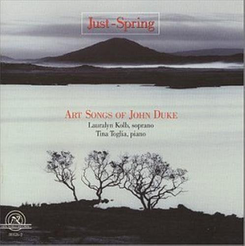 "Album cover featuring a serene lake scene with bare trees and a distant mountain."