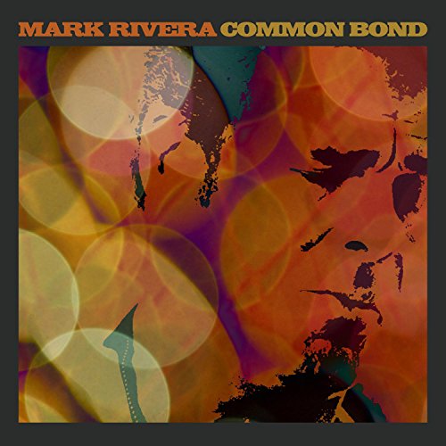 Album cover with orange and yellow bokeh lights, dark gray border, and artist's name.