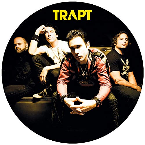 Vinyl record with band image and tracklist on a black background.