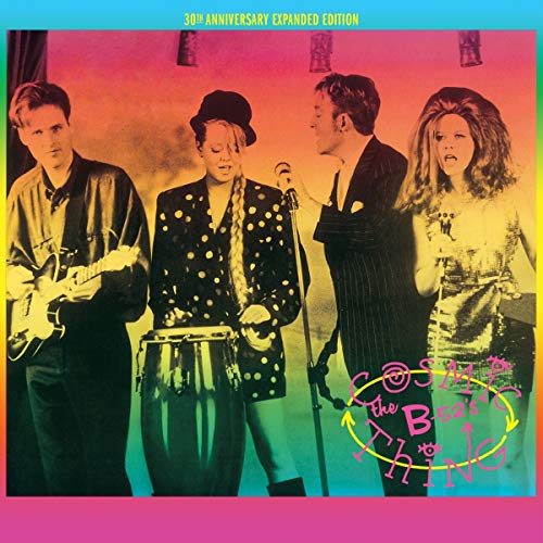 "Album cover of The B-52's Cosmic Thing with band members on a rainbow background."