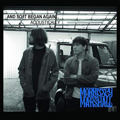 Black and white album cover with two men standing by a vehicle.