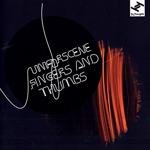 "Album cover with dark background, black circle, and orange brush strokes, featuring white text."