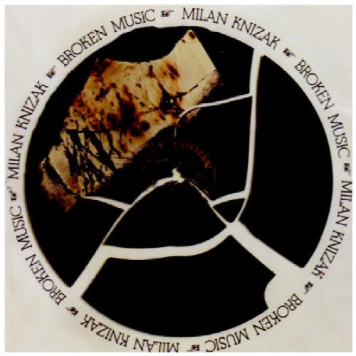 The image shows a CD cover with a broken vinyl record and text. The alt text is: "CD cover with broken vinyl record and 'Milan Knizak Broken Music' text."
