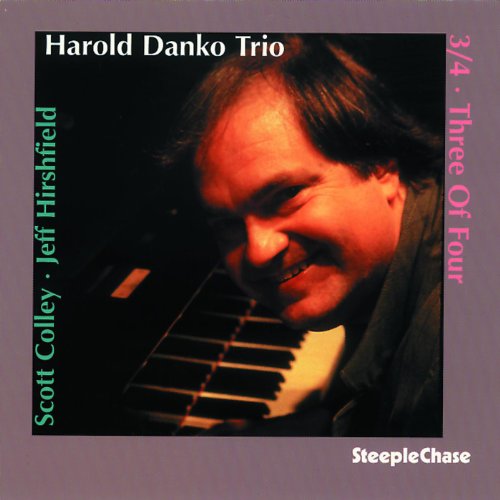 CD album cover with a man playing piano, surrounded by text on gray background.