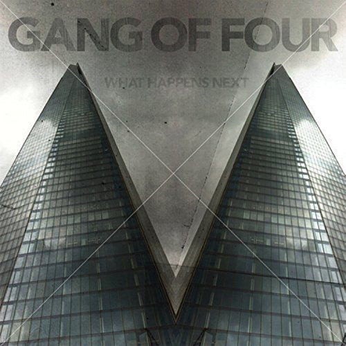 "Album cover featuring two tall, dark glass skyscrapers against a cloudy sky."