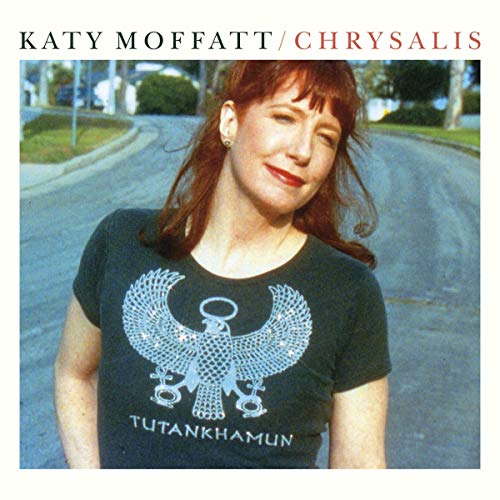 Album cover: woman with red hair wearing a black T-shirt with white Tutankhamun design.