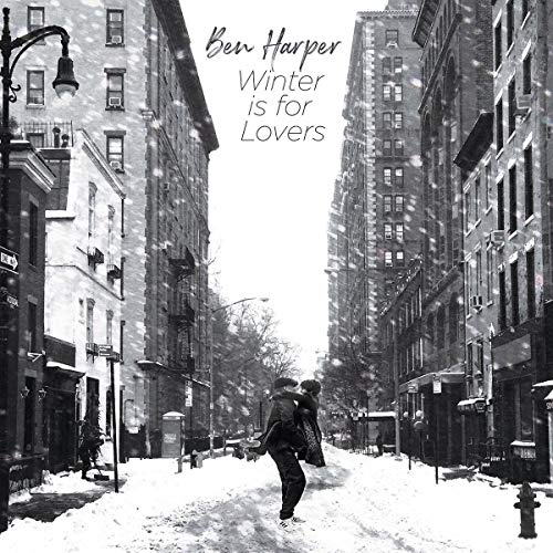"Black and white vinyl album cover featuring a snowy city street scene."