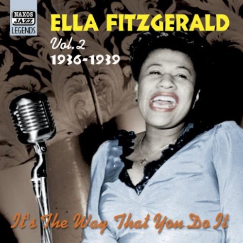 Ella Fitzgerald sings into a microphone on a CD cover with floral background.