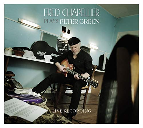 Album cover featuring a man playing guitar in a dressing room.
