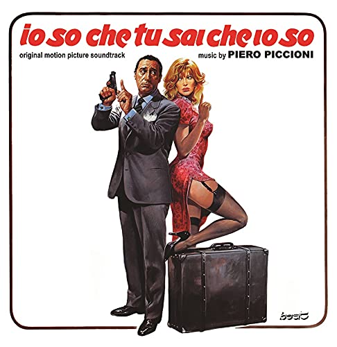 CD cover: man in suit, woman in red dress, and suitcase.